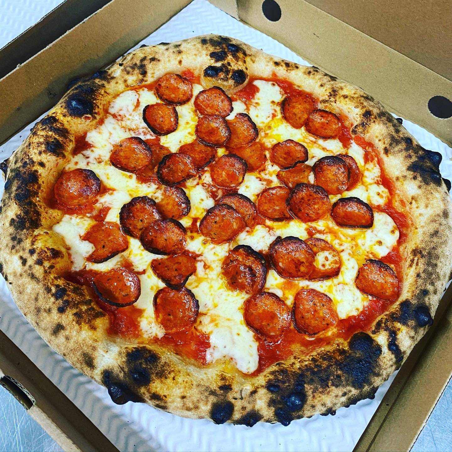 Whisk And Pickle Bee Sting pizza with Italian pepperoni and blistered crust